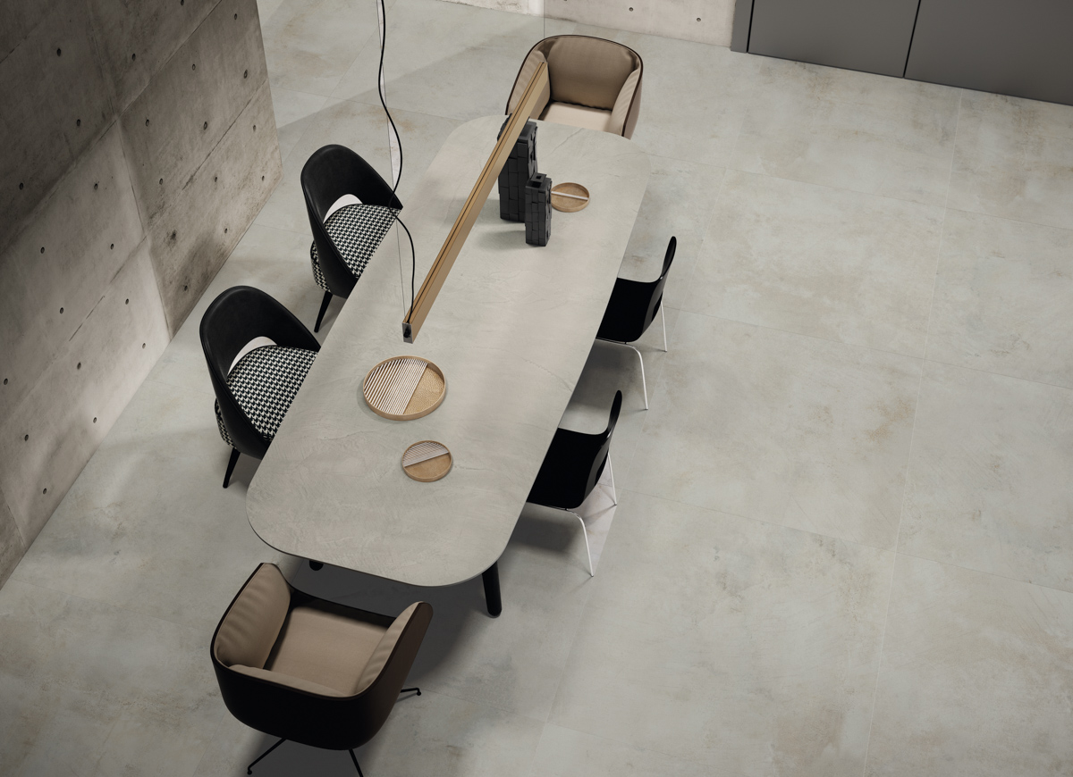 Kitchen with large-format grey rectified porcelain tiles and porcelain tiled table top