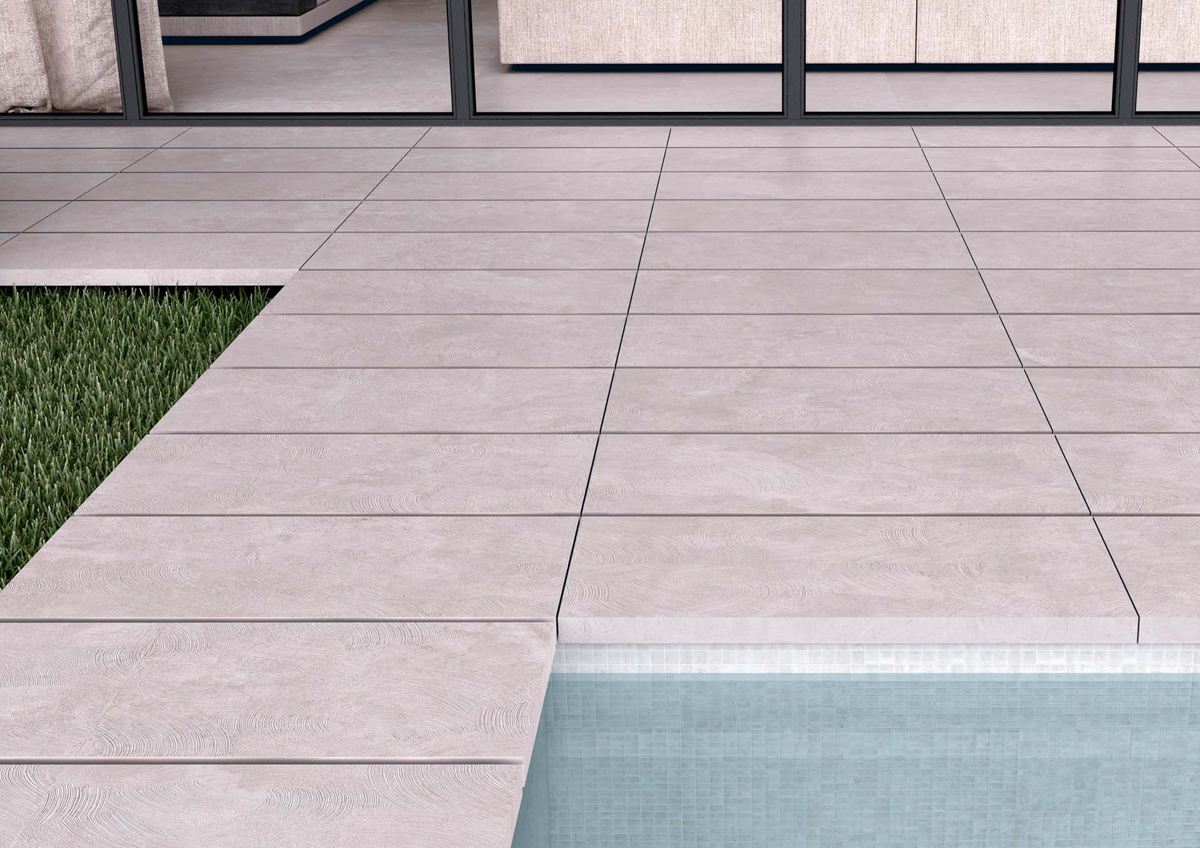 suelo porcelánico para piscina imitación piedra gris